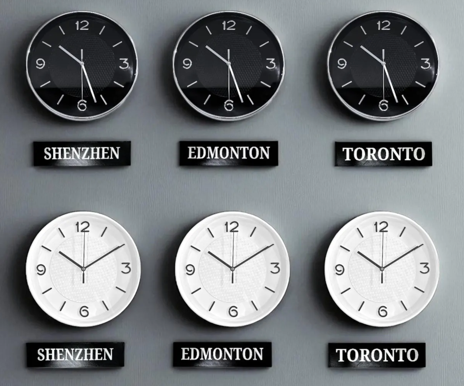 Black and white clock sets with Shenzhen, Edmonton and Toronto signs